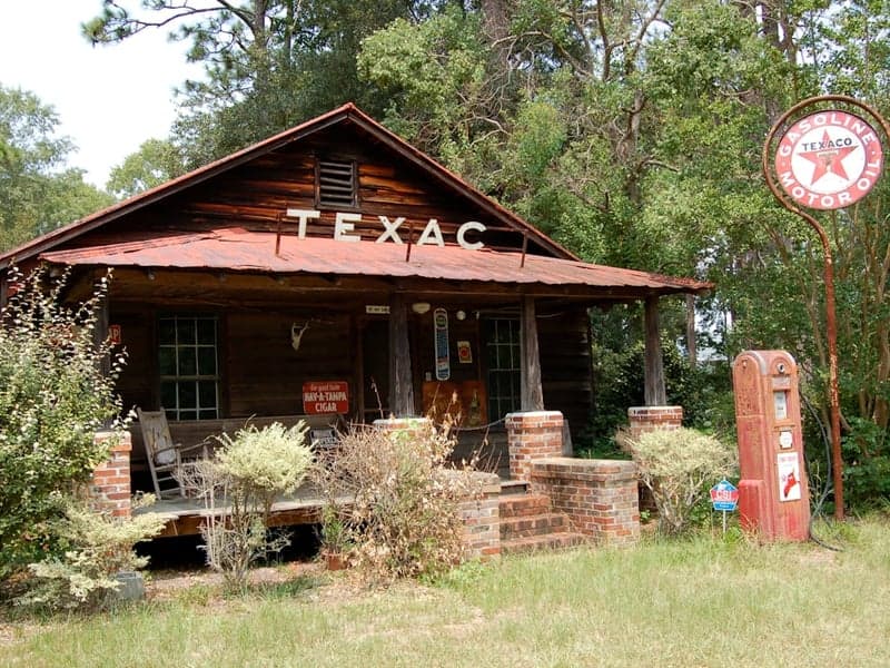 Leander - Small-Town Charm, Big-City Access Modern farmhouse-style home with wide front porch, white exterior, black trim in Leander